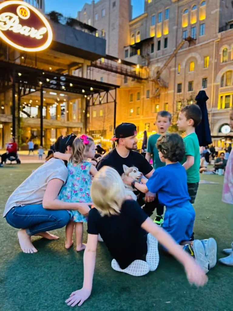 Aaron Rustici, A Dog trainer with his dog playing with kids in Kansas City